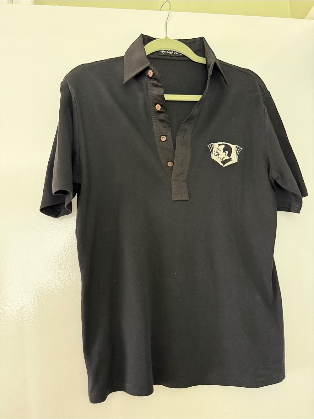 Men's Black Short-Sleeve Polo with Contrast Button Placket and Chest Emblem